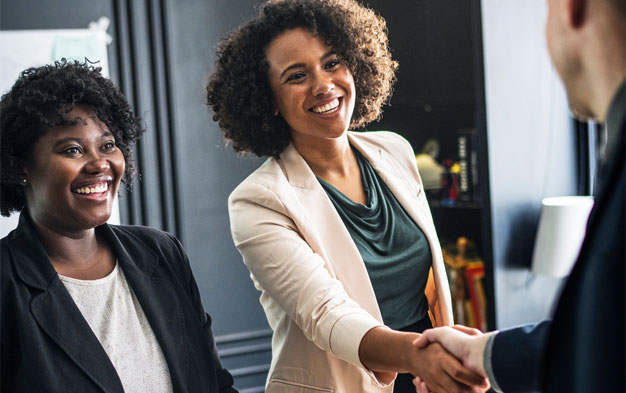 Woman shaking mans hand